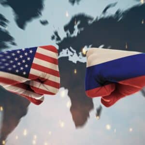U.S. and Russian Flags painted on face to face ists